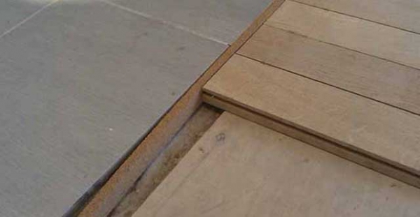 Пробковые компенсаторы: как состыковать разные покрытия пола